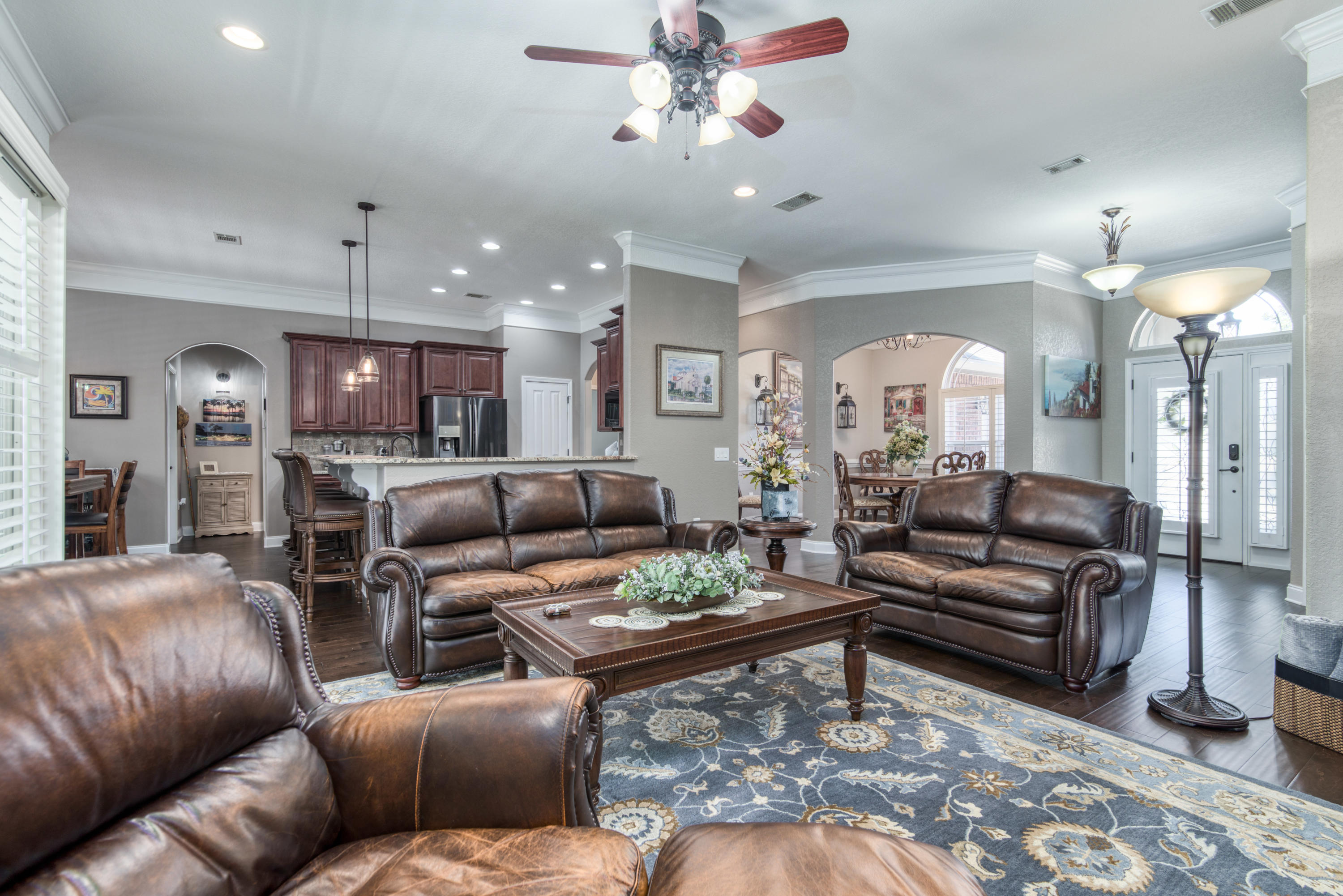 4563 Pfitzer Circle Crestview, FL 32536 - Photo 15 of 79 a living room with furniture kitchen view and a chandelier