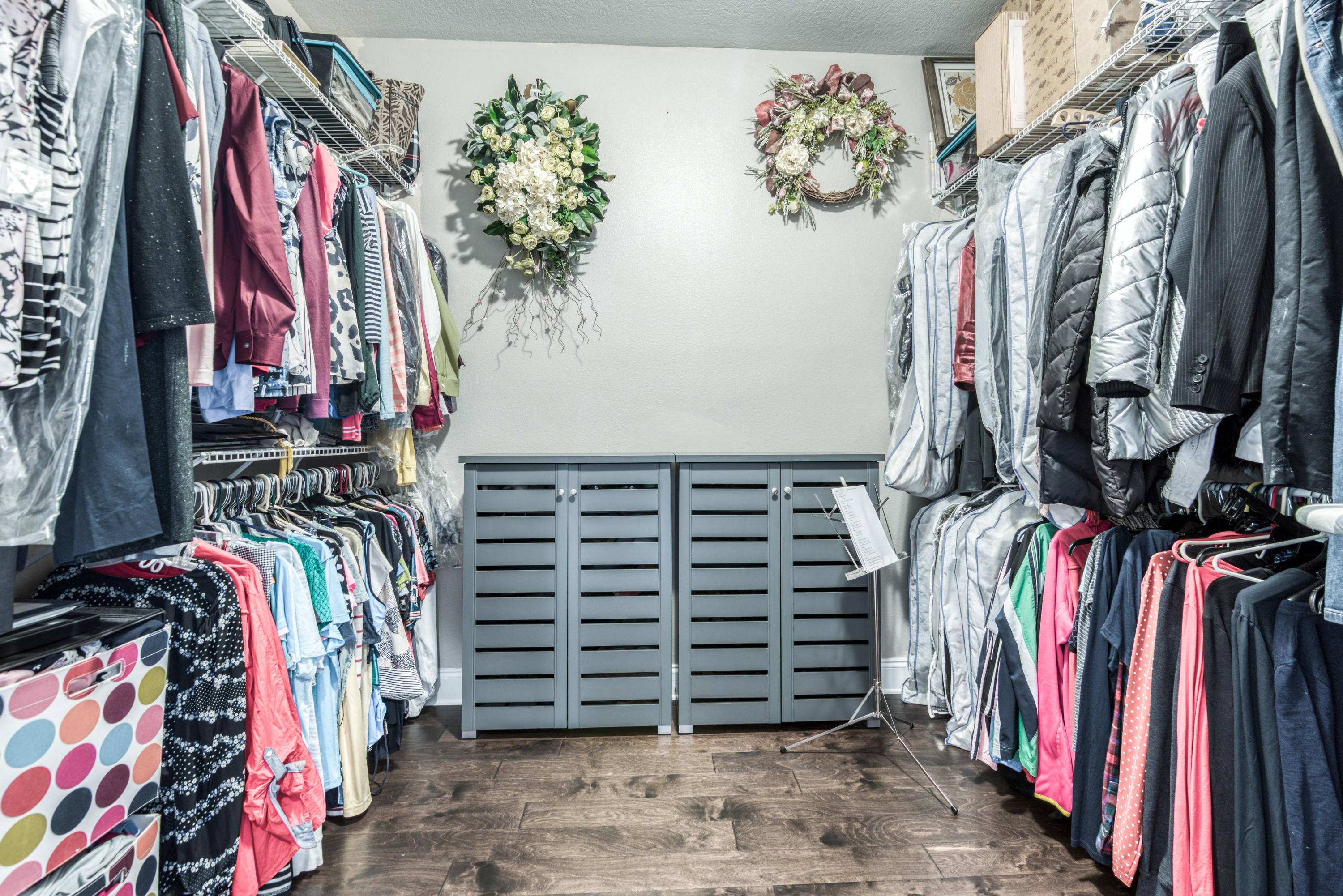 4563 Pfitzer Circle Crestview, FL 32536 - Photo 36 of 79 a view of walk in closet with clothes
