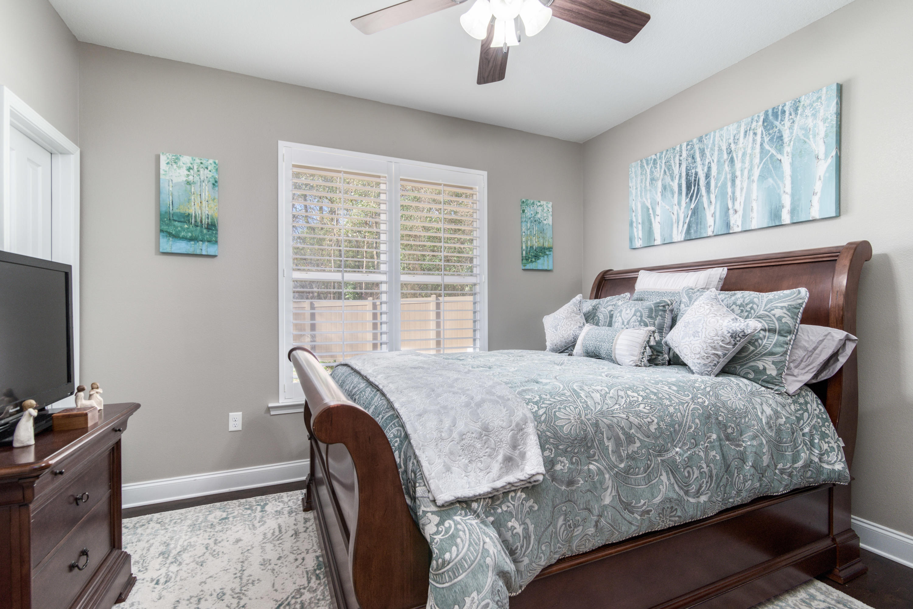 4563 Pfitzer Circle Crestview, FL 32536 - Photo 37 of 79 a bedroom with a bed and a flat screen tv