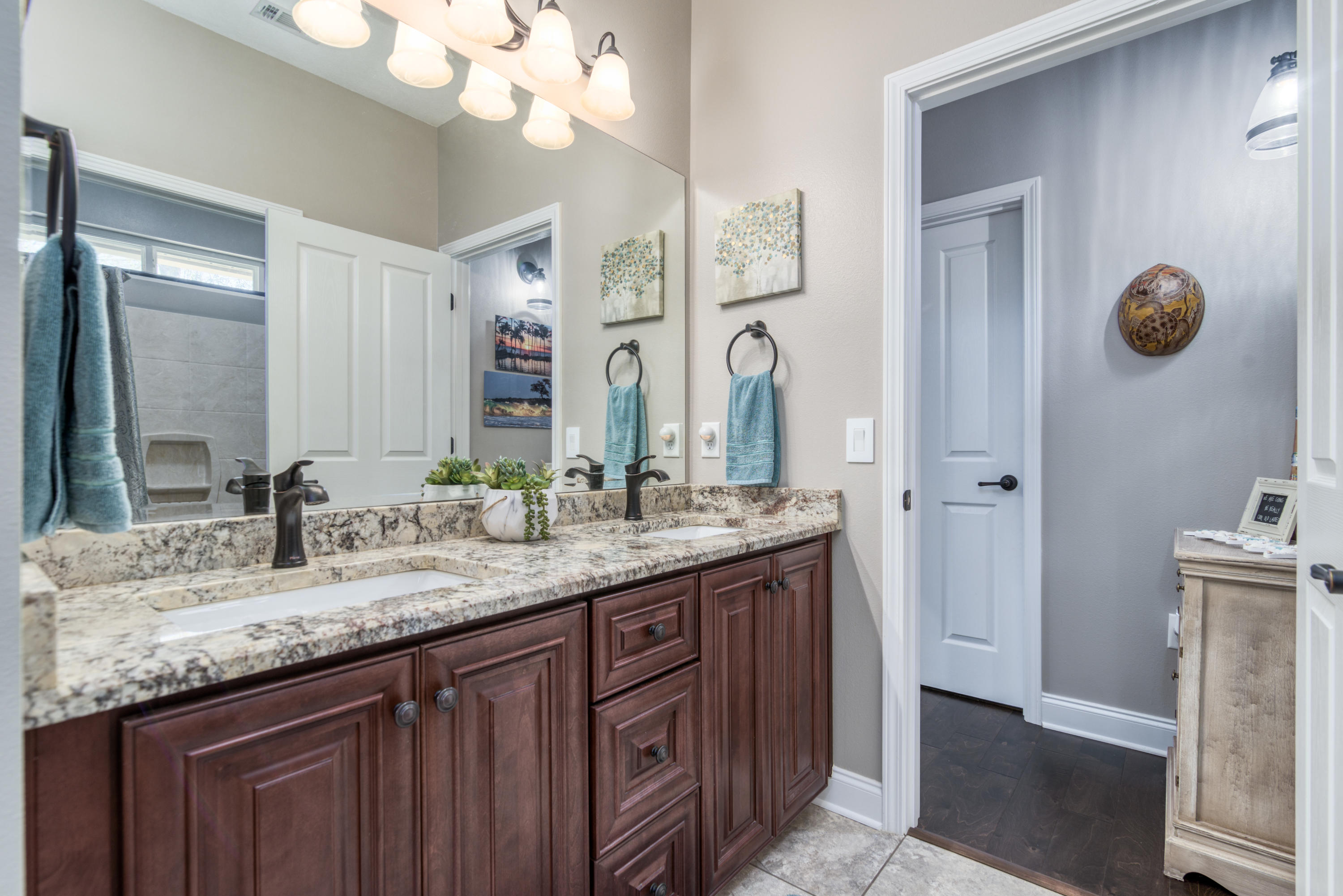 4563 Pfitzer Circle Crestview, FL 32536 - Photo 39 of 79 a bathroom with a granite countertop sink and a mirror