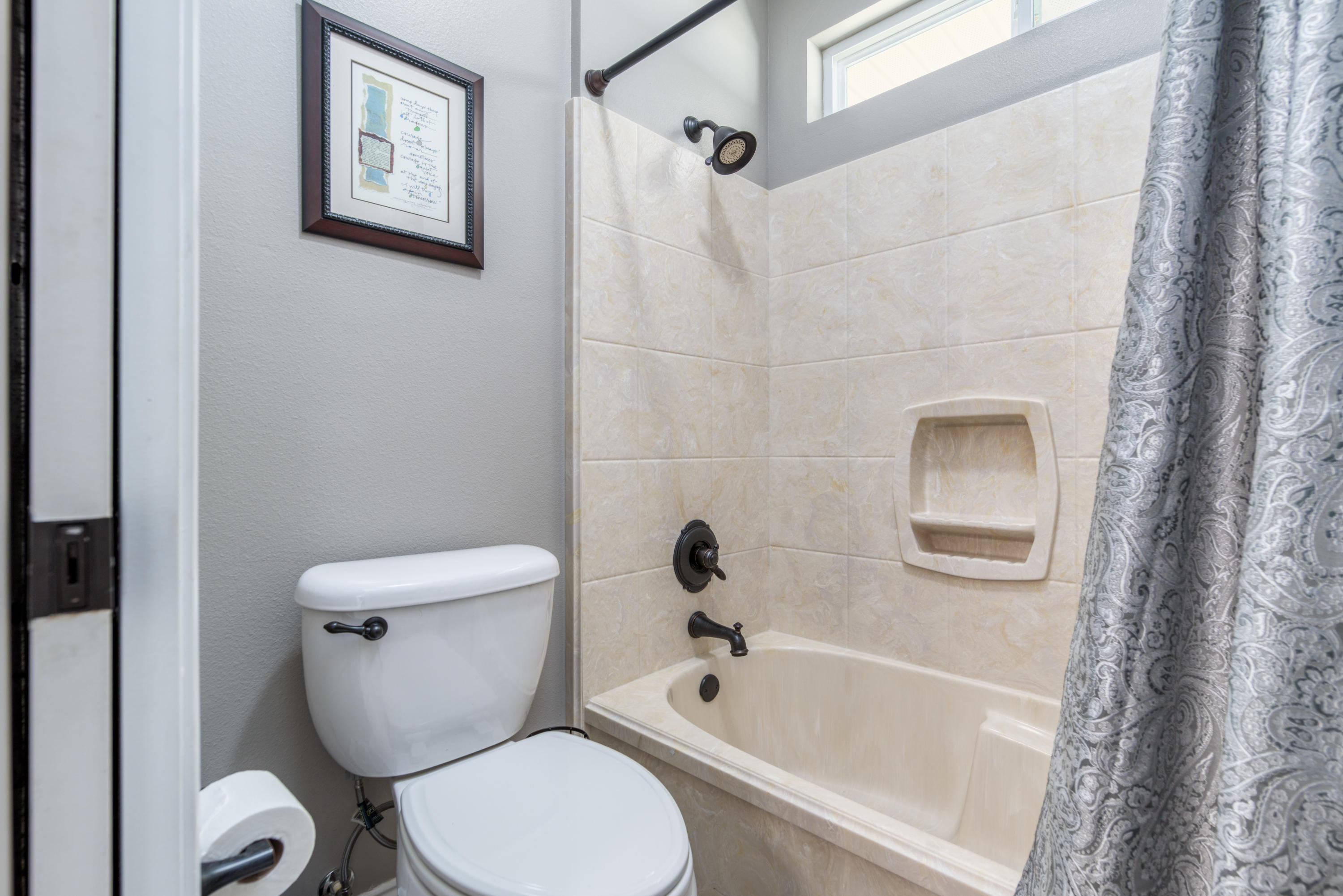 4563 Pfitzer Circle Crestview, FL 32536 - Photo 41 of 79 a white toilet sitting next to a bath tub and a shower