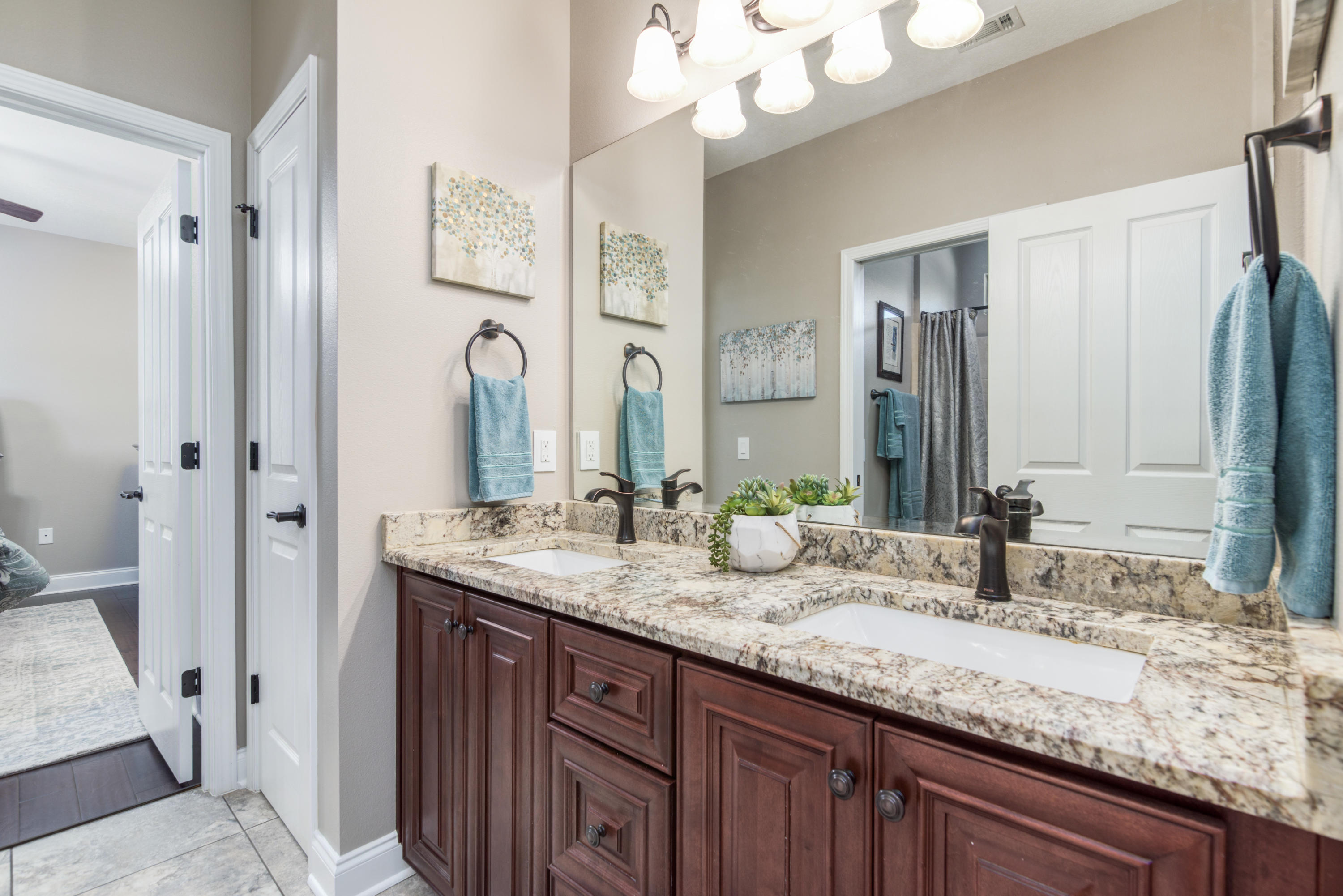 4563 Pfitzer Circle Crestview, FL 32536 - Photo 43 of 79 a bathroom with a granite countertop double vanity sink and mirror