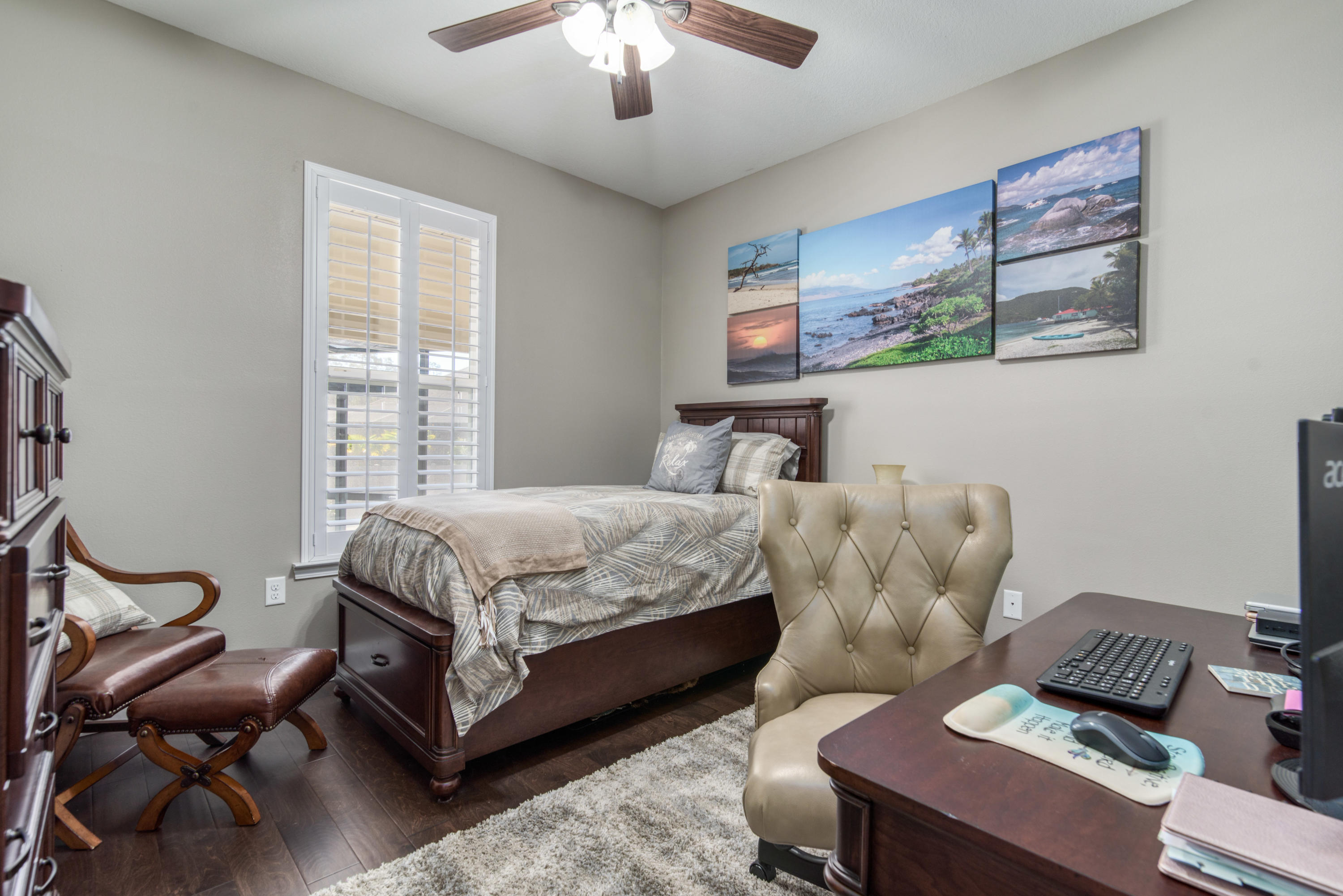 4563 Pfitzer Circle Crestview, FL 32536 - Photo 5 of 79 a bedroom with a bed and a chandelier