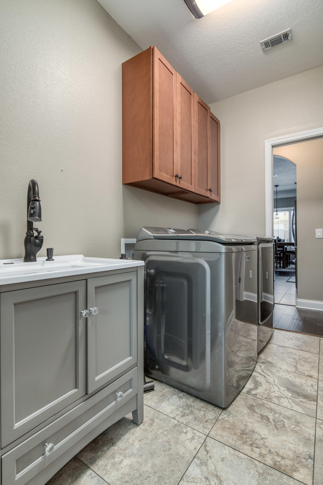 4563 Pfitzer Circle Crestview, FL 32536 - Photo 58 of 79 a kitchen with stainless steel appliances granite countertop a sink a stove and cabinets