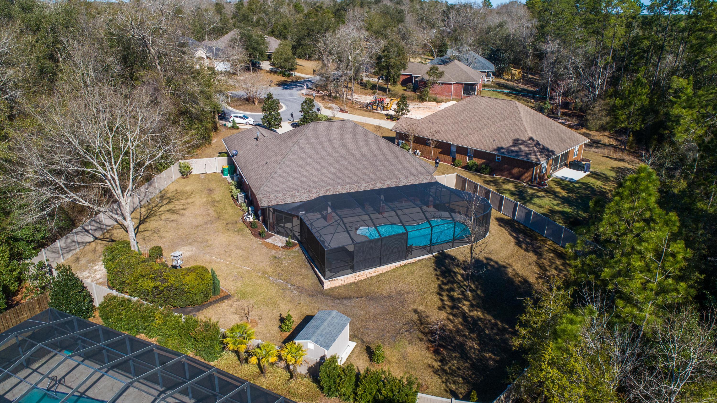 4563 Pfitzer Circle Crestview, FL 32536 - Photo 75 of 79 an aerial view of a house with a yard and lake view