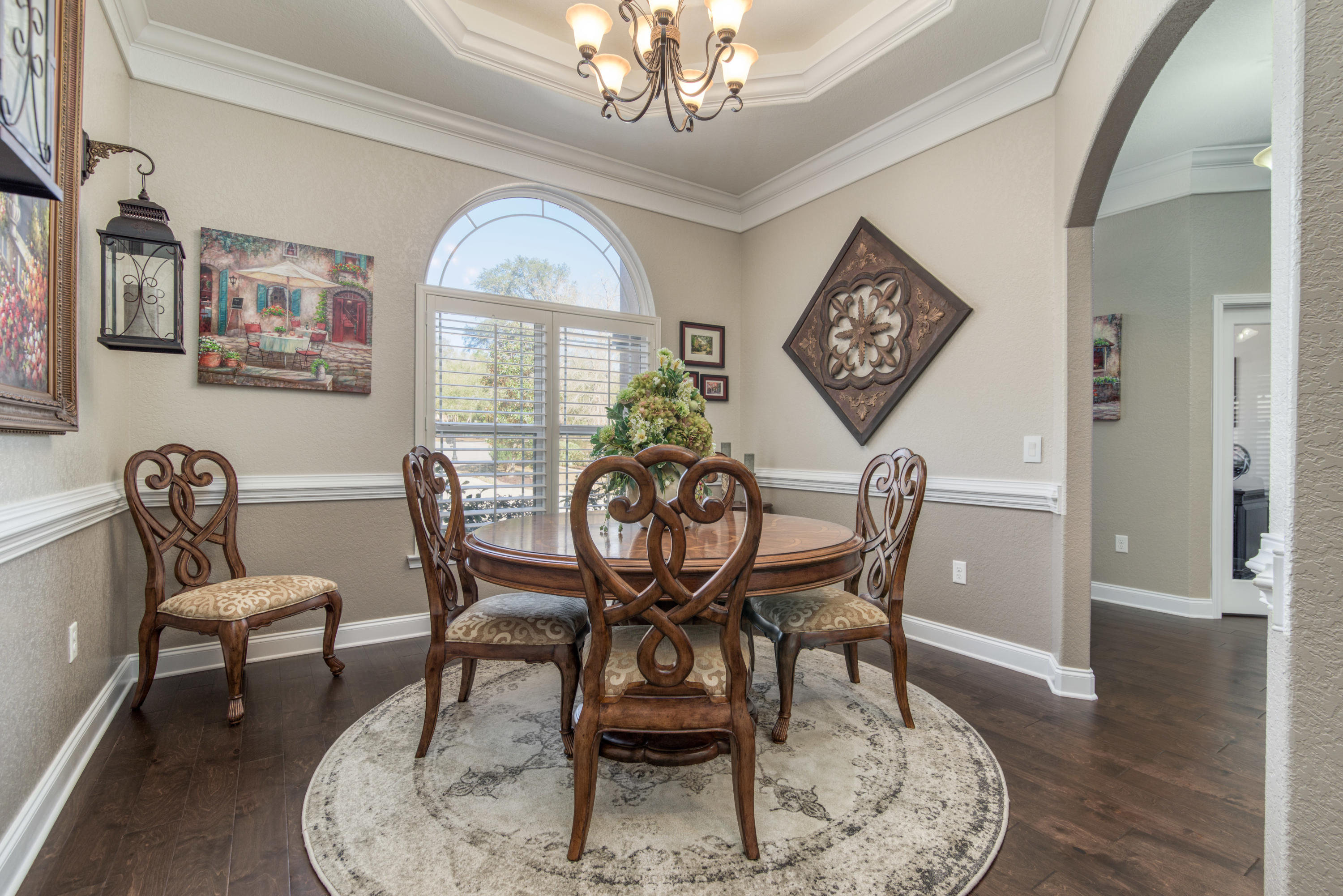 4563 Pfitzer Circle Crestview, FL 32536 - Photo 9 of 79 a view of a dining room with furniture wooden floor and a chandelier