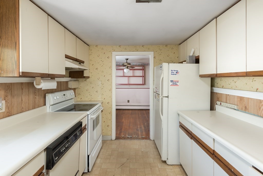 409 Bay Road Easton, MA 02375 - Photo 11 of 26 a kitchen with a stove a refrigerator and a sink