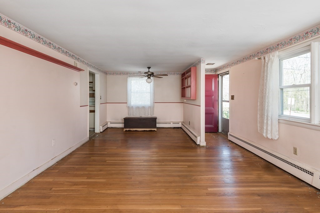 409 Bay Road Easton, MA 02375 - Photo 13 of 26 a view of empty room with wooden floor and window