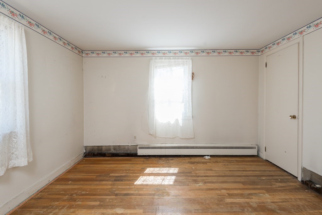 409 Bay Road Easton, MA 02375 - Photo 18 of 26 a view of room with hardwood floor and white walls