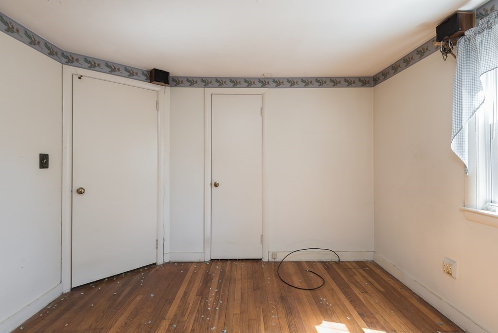 409 Bay Road Easton, MA 02375 - Photo 19 of 26 a view of a room with wooden floor and a window