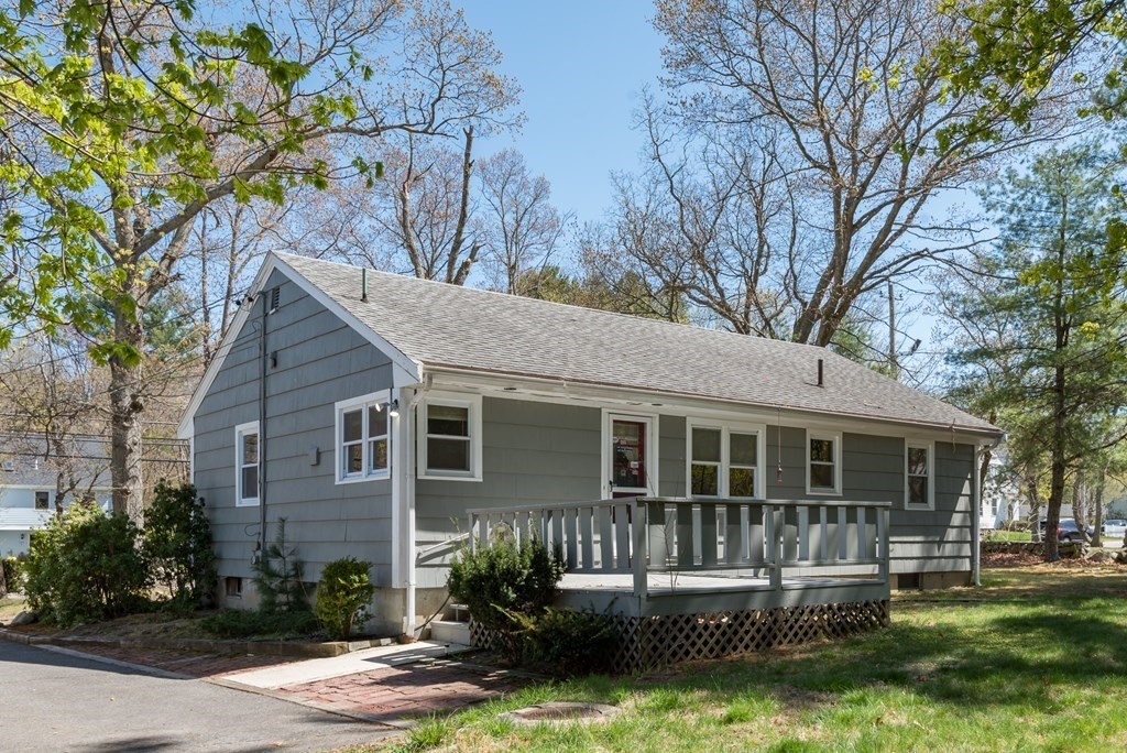 409 Bay Road Easton, MA 02375 - Photo 4 of 26 front view of a house with a yard table and chairs