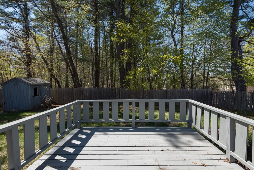 409 Bay Road Easton, MA 02375 - Photo 7 of 26 a view of balcony with wooden floor and fence