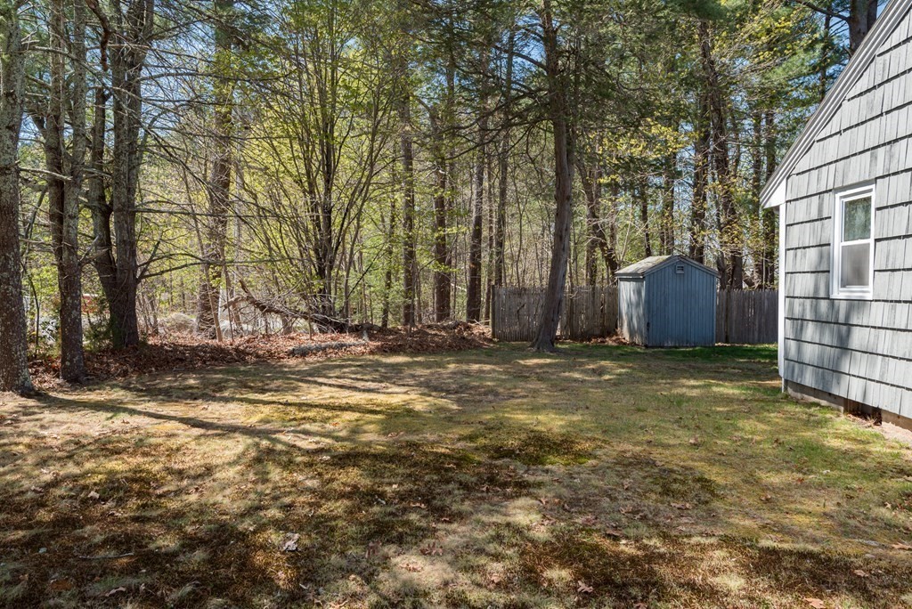 409 Bay Road Easton, MA 02375 - Photo 8 of 26 a backyard of a house with a large trees