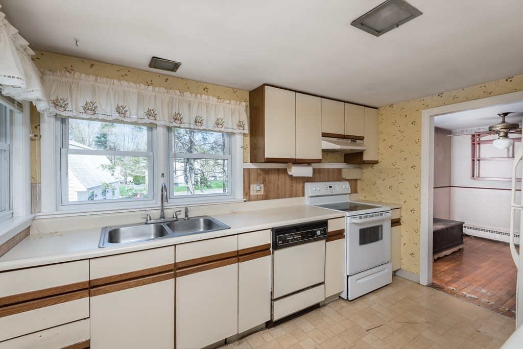 409 Bay Road Easton, MA 02375 - Photo 10 of 26 a kitchen with a sink stove and cabinets