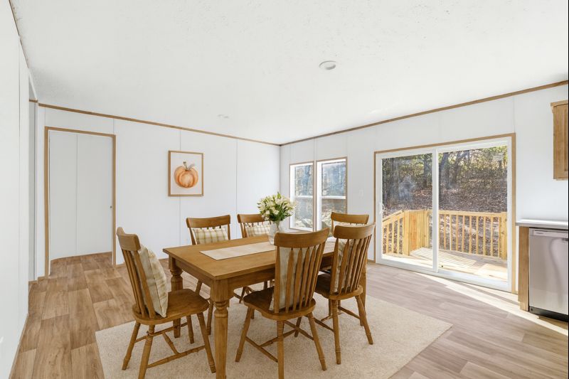 149 Newton Road Pickens, SC 29671 - Photo 4 of 29 This bright dining area offers direct access to an outdoor deck, perfect for seamless indoor-outdoor living.