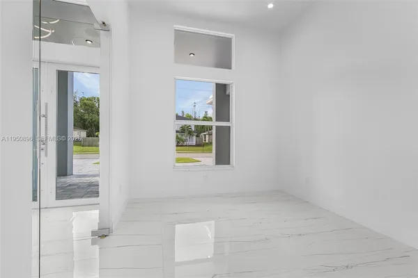 a view of a bathroom with a tub and window