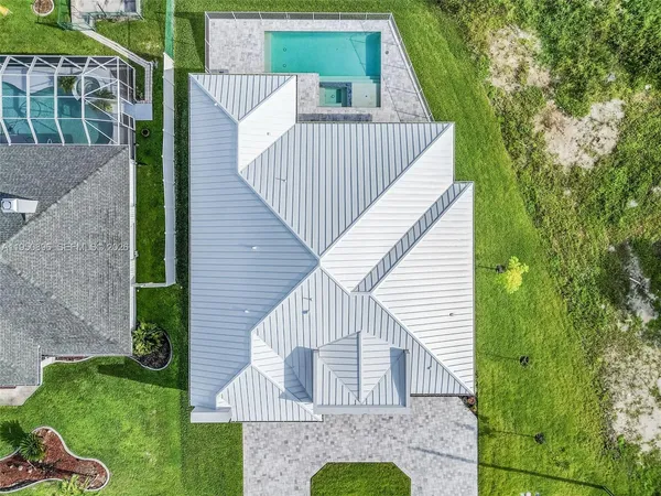 a view of backyard with a garden and deck