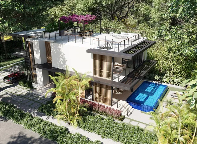 a view of a house with yard and sitting area