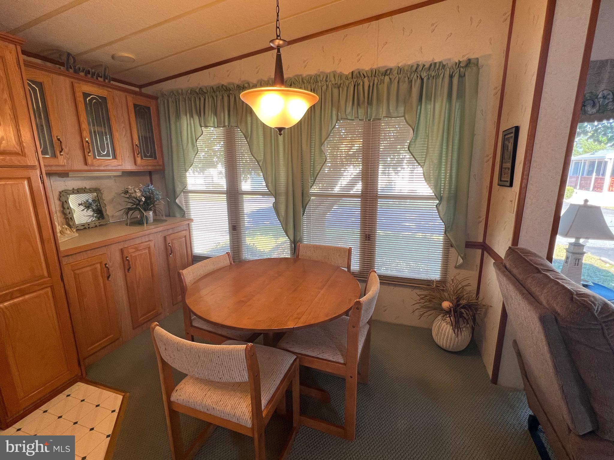 12412 Windlass Way Berlin, MD 21811 - Photo 9 of 105 a view of a dining room with furniture window and wooden floor