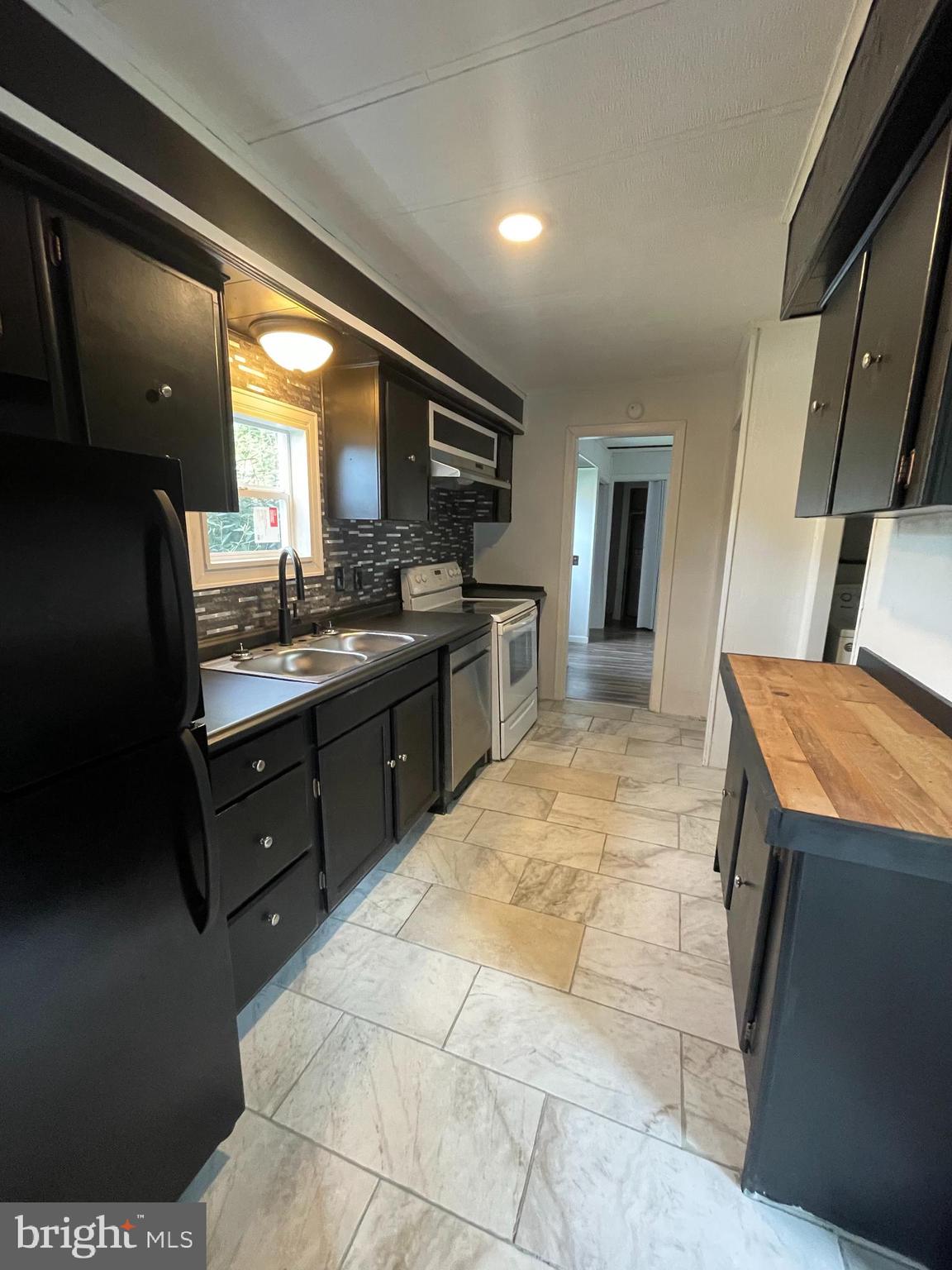 321 Lewis Road Annville, PA 17003 - Photo 11 of 30 a kitchen with a sink stove and refrigerator