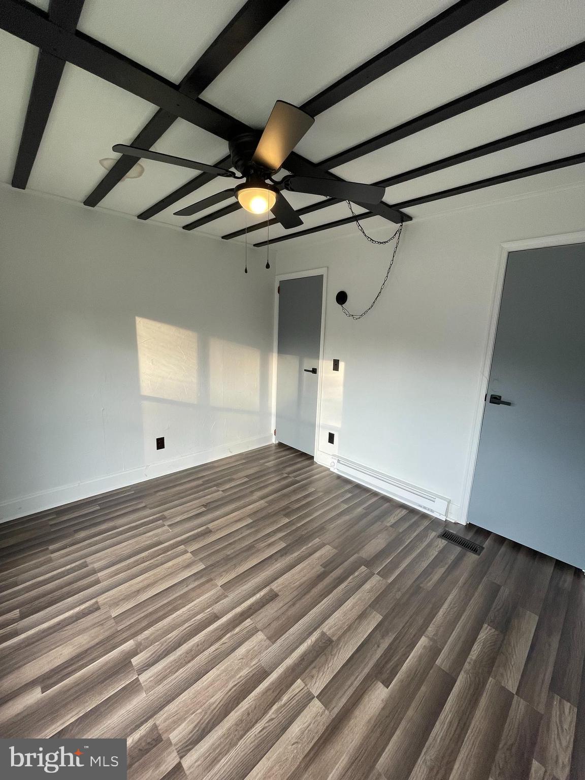 321 Lewis Road Annville, PA 17003 - Photo 22 of 30 a view of a room with wooden floor and a ceiling fan