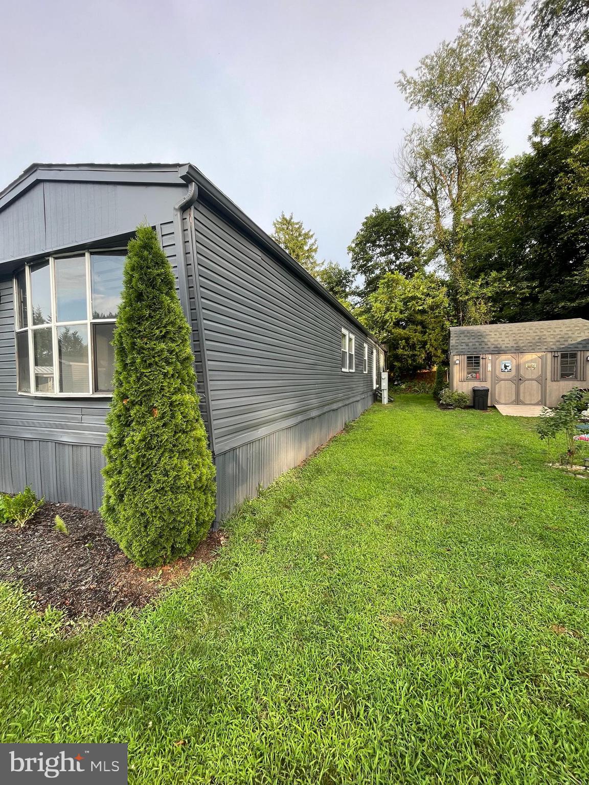 321 Lewis Road Annville, PA 17003 - Photo 4 of 30 a backyard of a house with plants and large tree