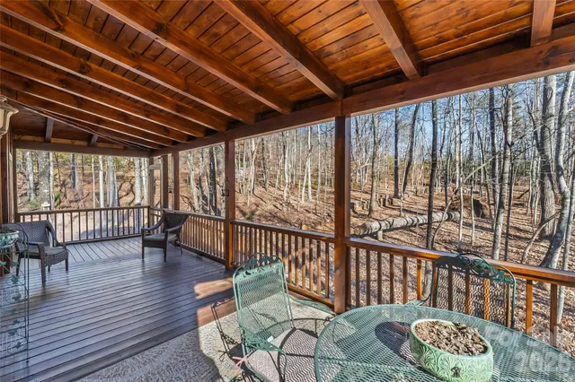 a view of staircase with furniture and wooden floor