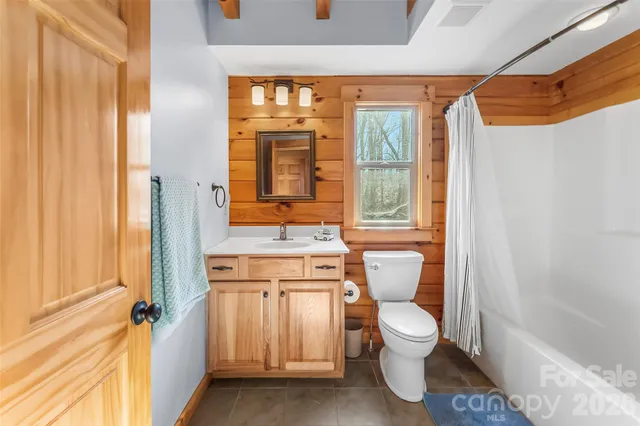a bathroom with a toilet sink and a bathtub