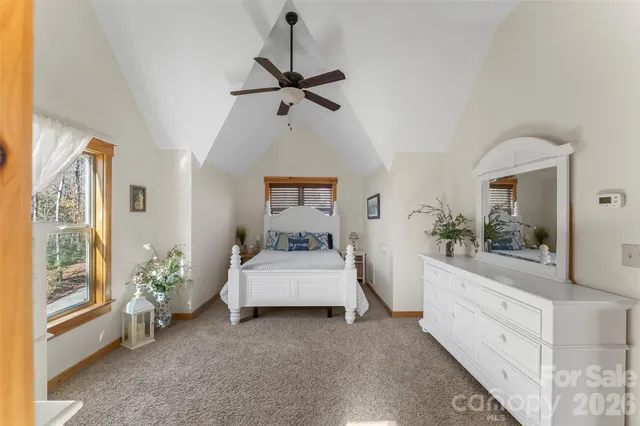 a bedroom with bed and window