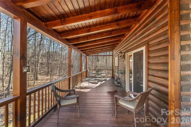 a view of two chairs in the balcony