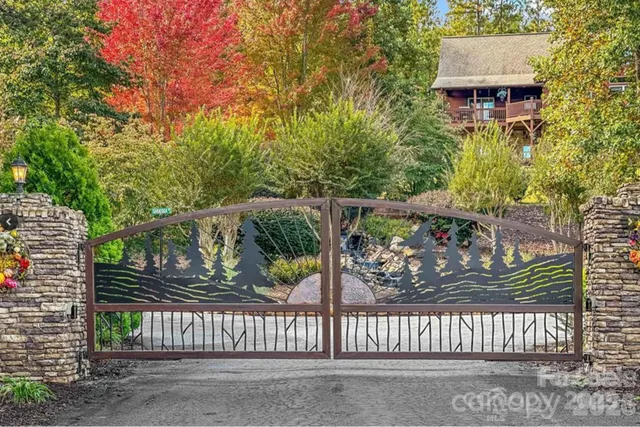 a backyard of a house with barbeque oven table and chairs