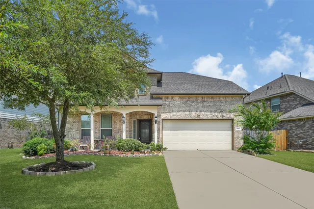 a view of a house with a yard and plants
