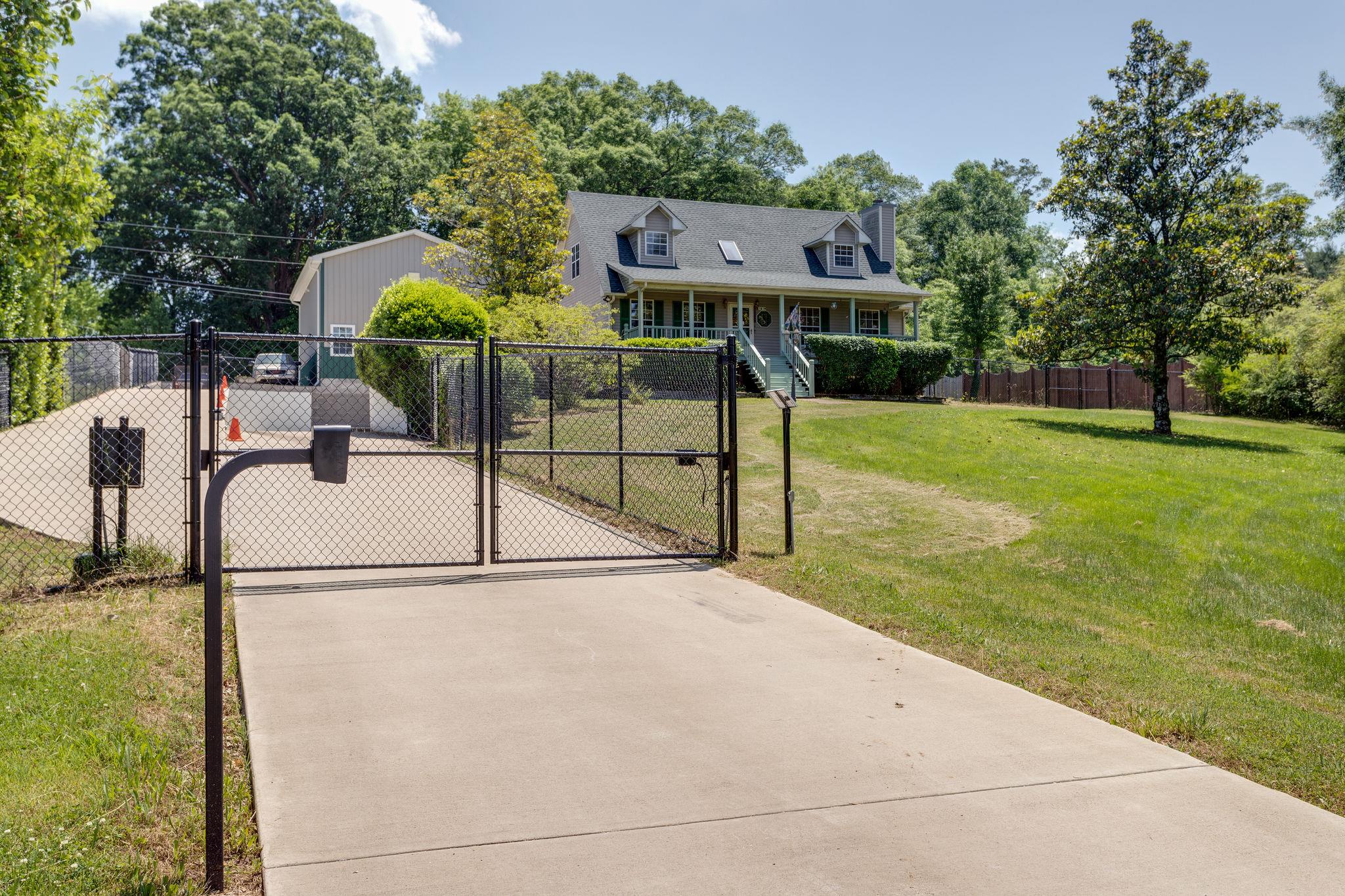 1819 Seavy Hight Road Columbia, TN 38401 - Photo 2 of 30 Situated on 1.46 acre lot. The home features a Security Gate, Concrete Drive & is Fenced around; more than half of the Acreage.