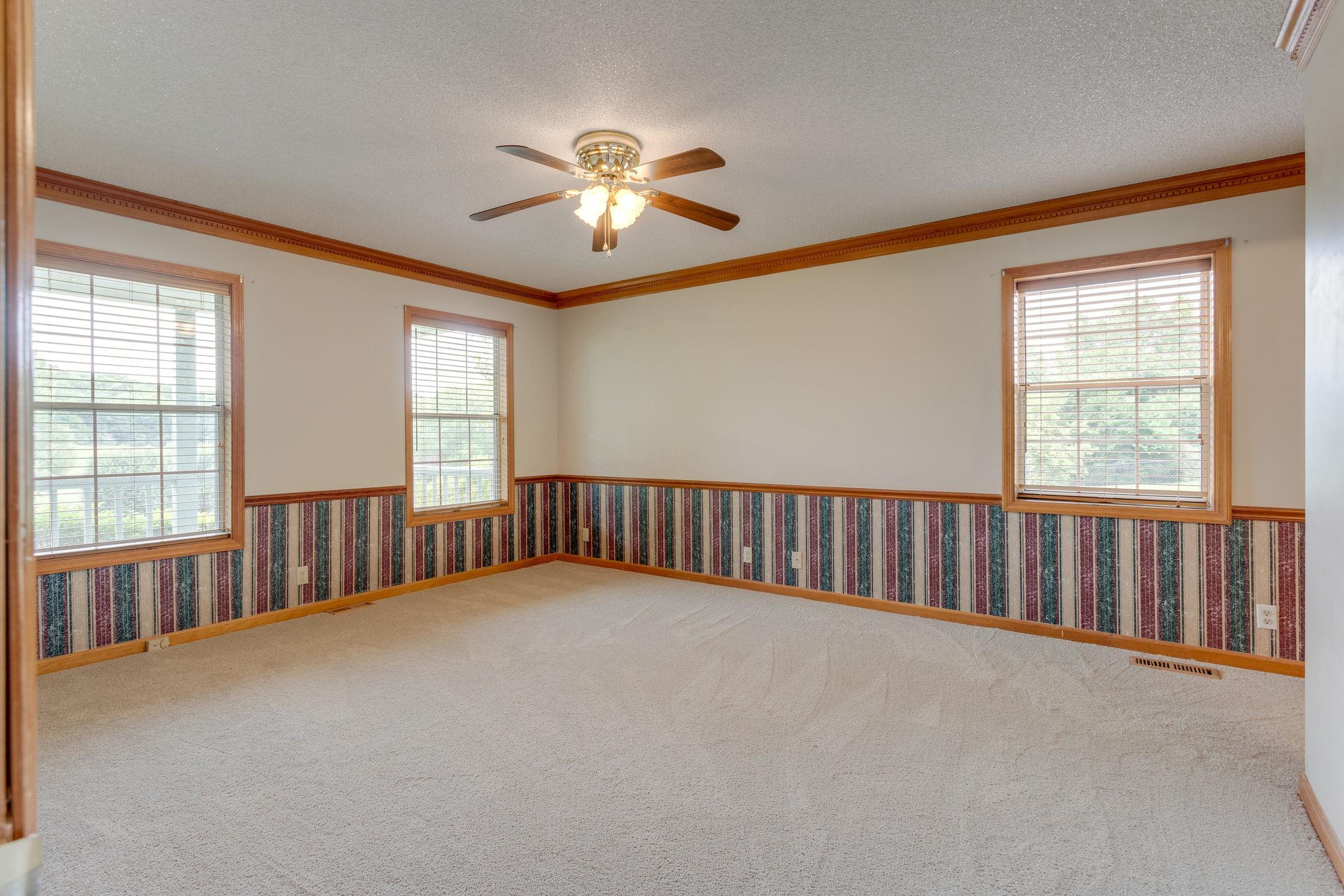 1819 Seavy Hight Road Columbia, TN 38401 - Photo 14 of 30 Master Bedroom with Brown Molding, Chair Railings, & wood trimmed Windows.