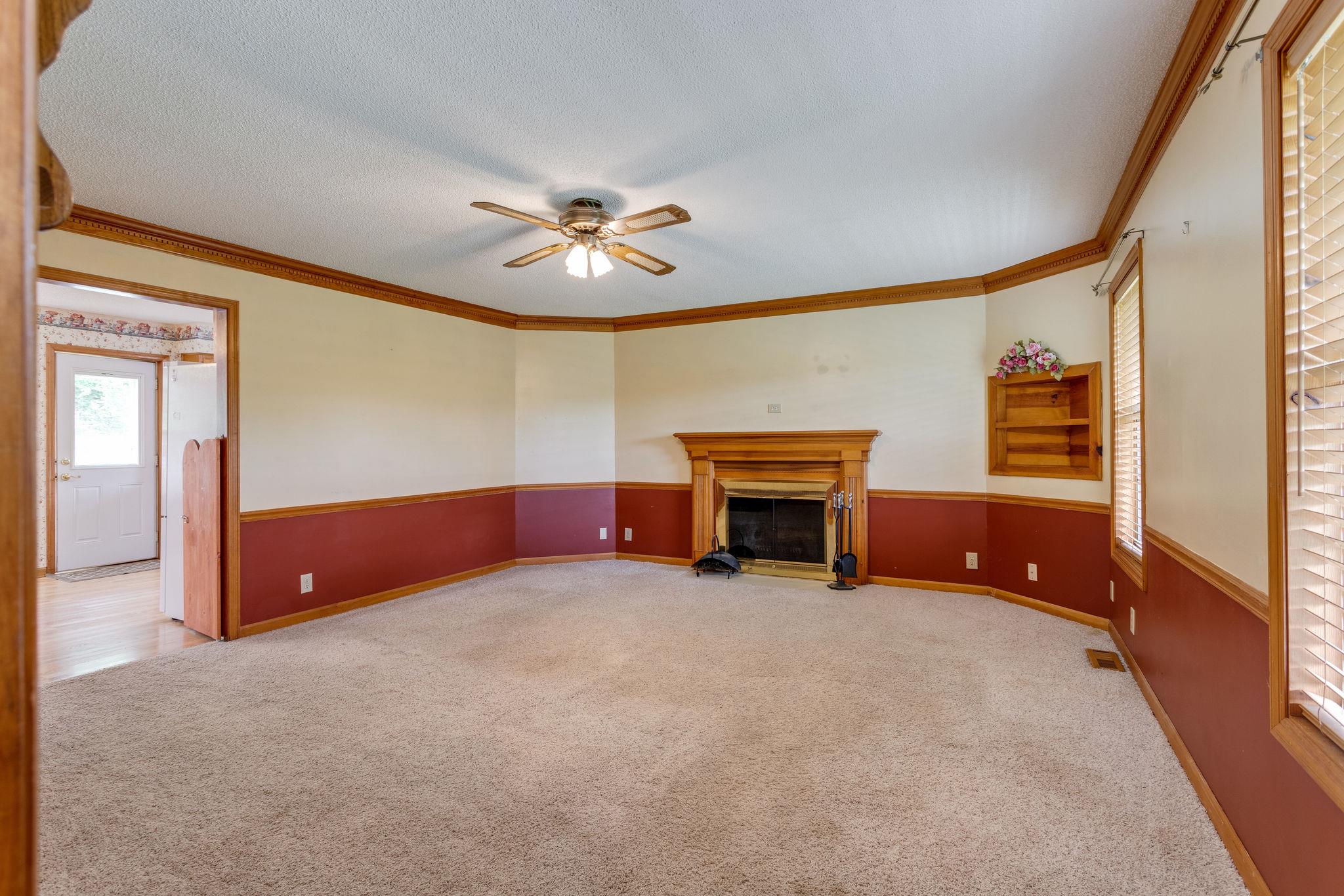 1819 Seavy Hight Road Columbia, TN 38401 - Photo 6 of 30 Living Room with Fireplace, Built-In Shelf & Ceiling Fan.