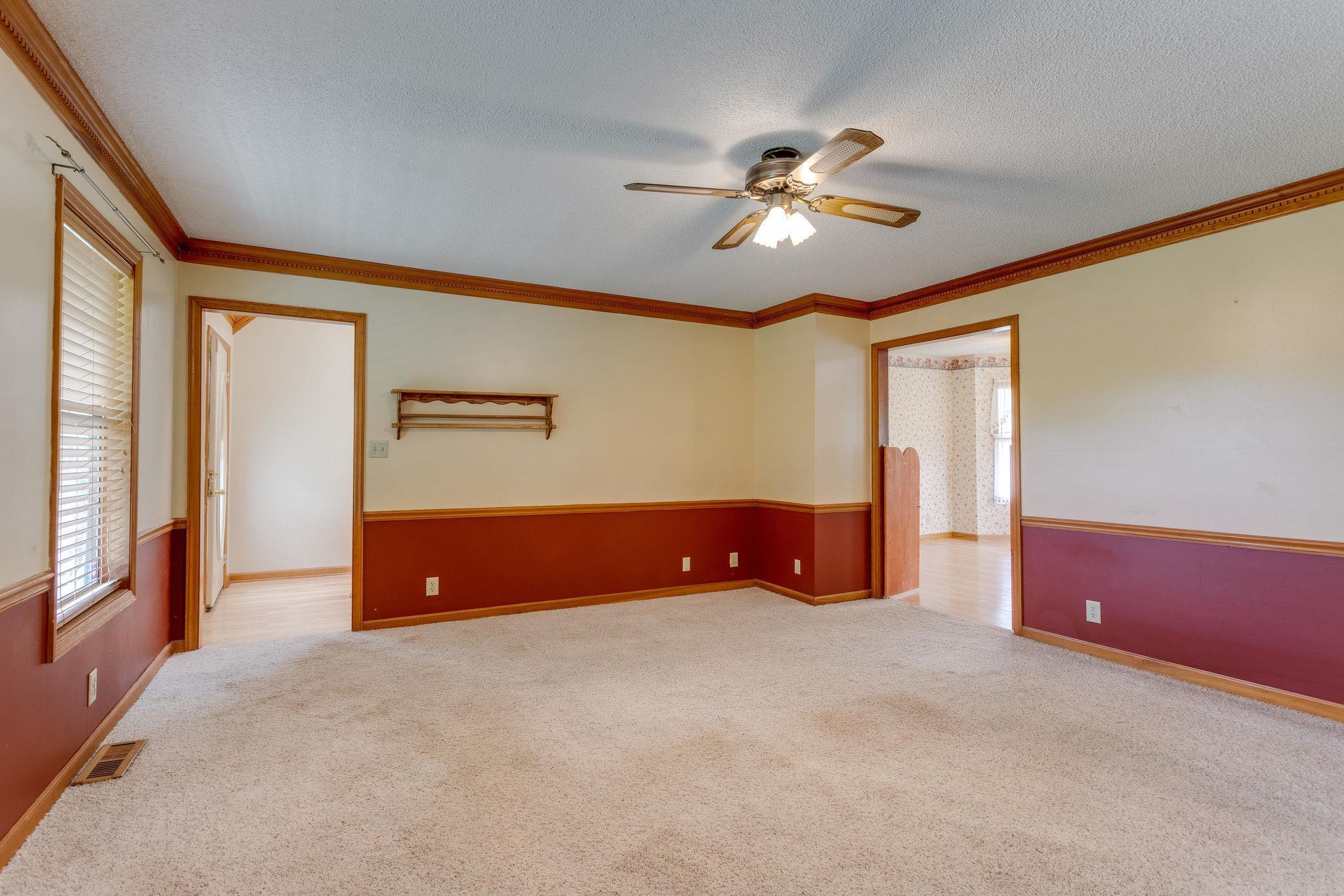 1819 Seavy Hight Road Columbia, TN 38401 - Photo 8 of 30 Carpeted Flooring, with Ceiling Fan, Crown Molding & Chair Railing.
