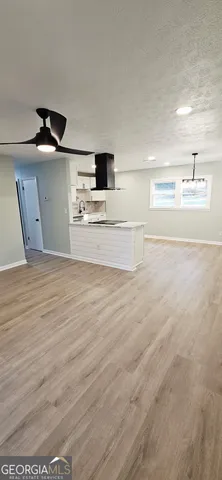 a view of a kitchen with a sink