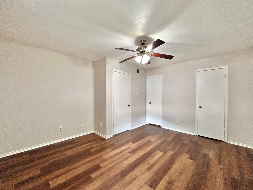 7111 East Highway 290, Unit C Austin, TX 78723 - Photo 12 of 20 a view of an empty room with wooden floor