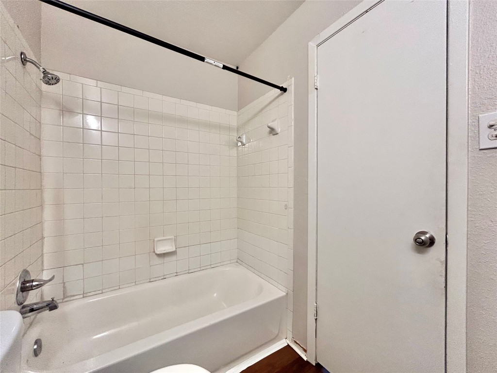 7111 East Highway 290, Unit C Austin, TX 78723 - Photo 17 of 20 a bathroom with a shower and a bathtub