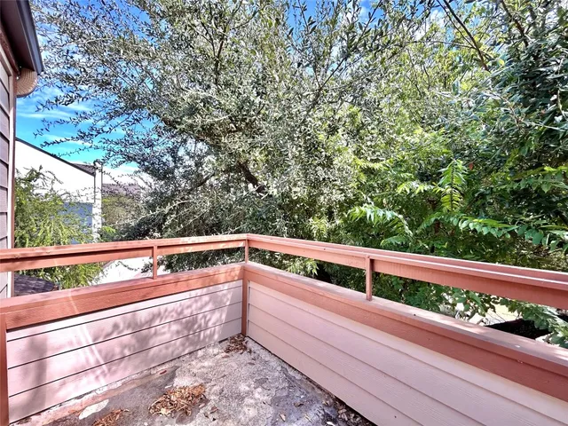 a view of balcony with wooden floor