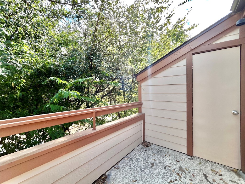 7111 East Highway 290, Unit C Austin, TX 78723 - Photo 20 of 20 a view of a bench in a balcony