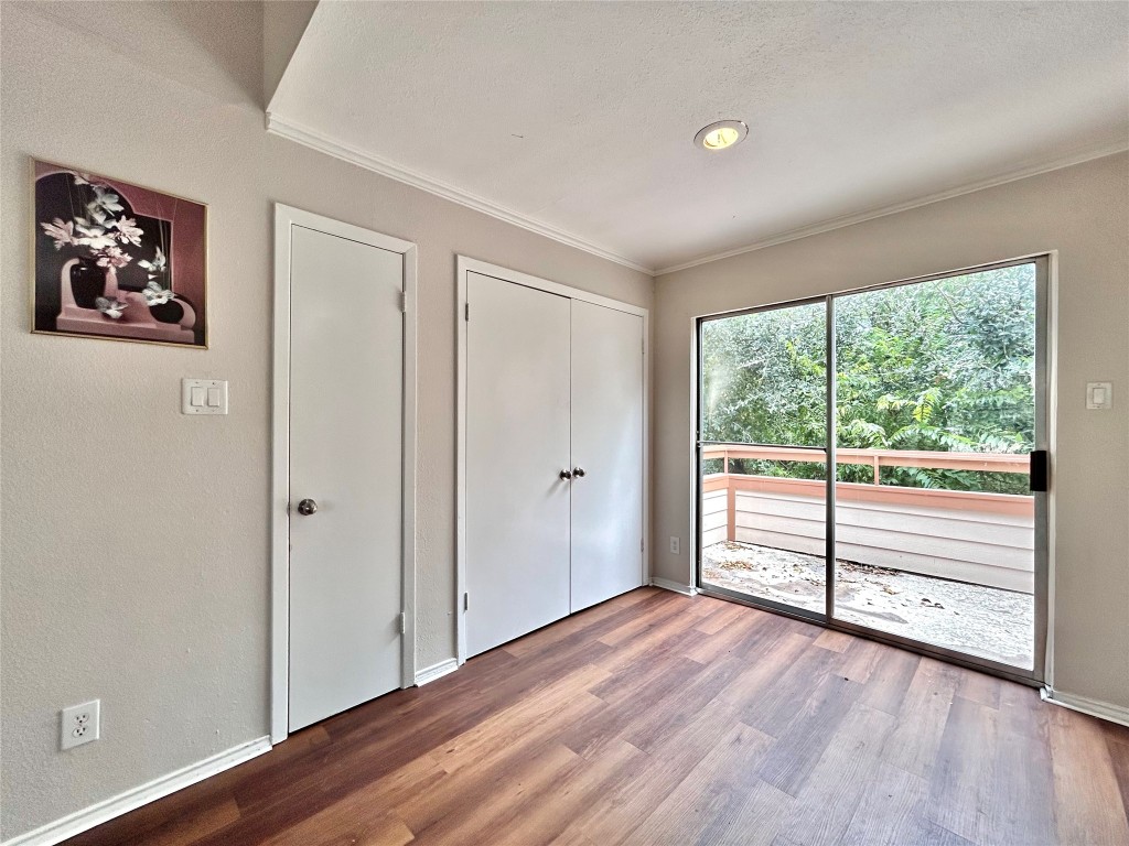 7111 East Highway 290, Unit C Austin, TX 78723 - Photo 5 of 20 a view of a room with wooden floor and window