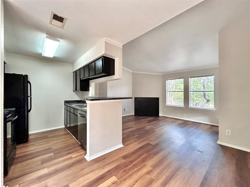 7111 East Highway 290, Unit C Austin, TX 78723 - Photo 6 of 20 a view of kitchen with furniture microwave and refrigerator