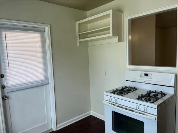 a kitchen with a stove and a microwave
