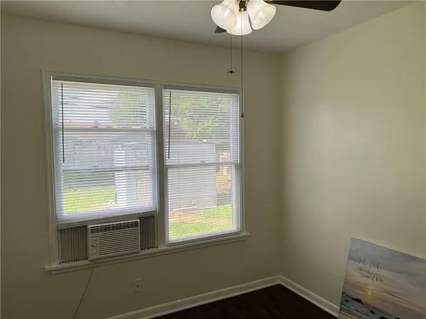 a view of an empty room with a window