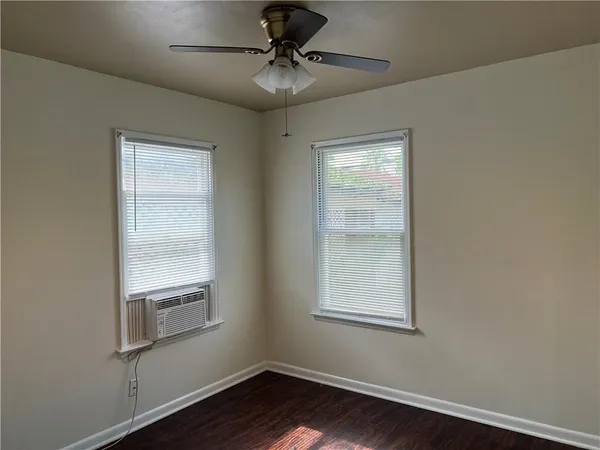 a room with window and a ceiling fan