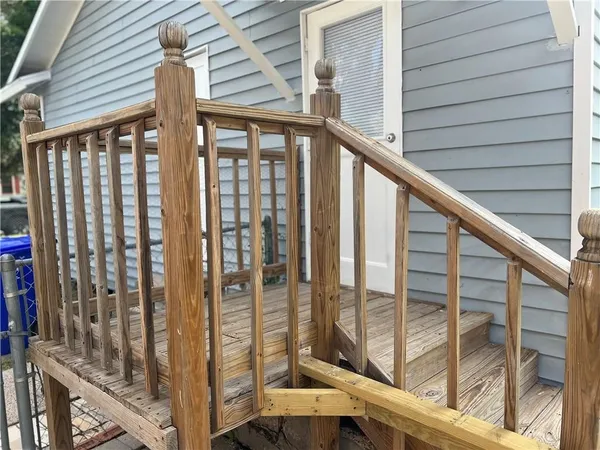 a view of balcony with floor to ceiling window and wooden floor