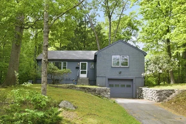 a front view of a house with yard