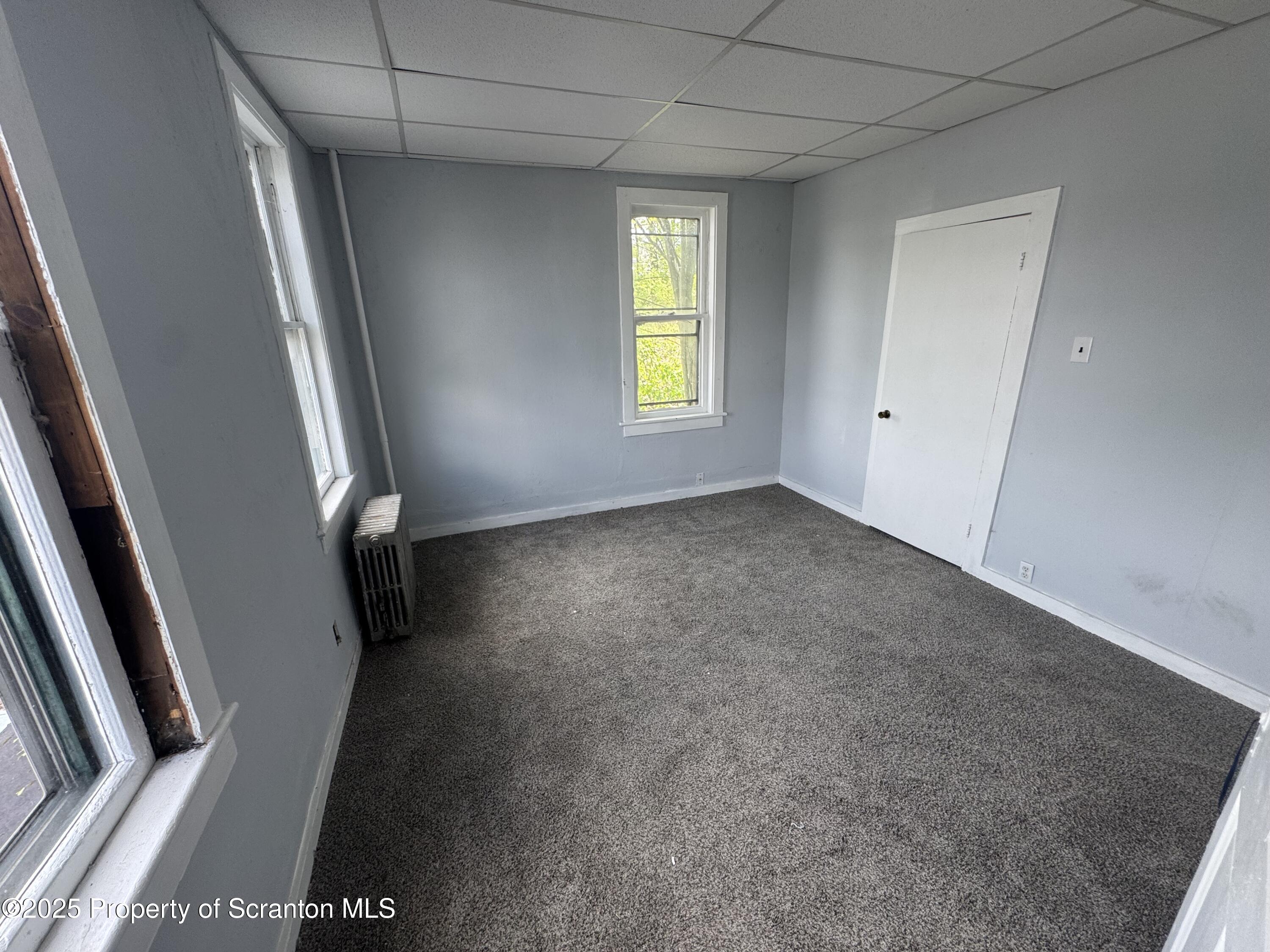 627 South Blakely Street Scranton, PA 18510 - Photo 6 of 13 an empty room with windows