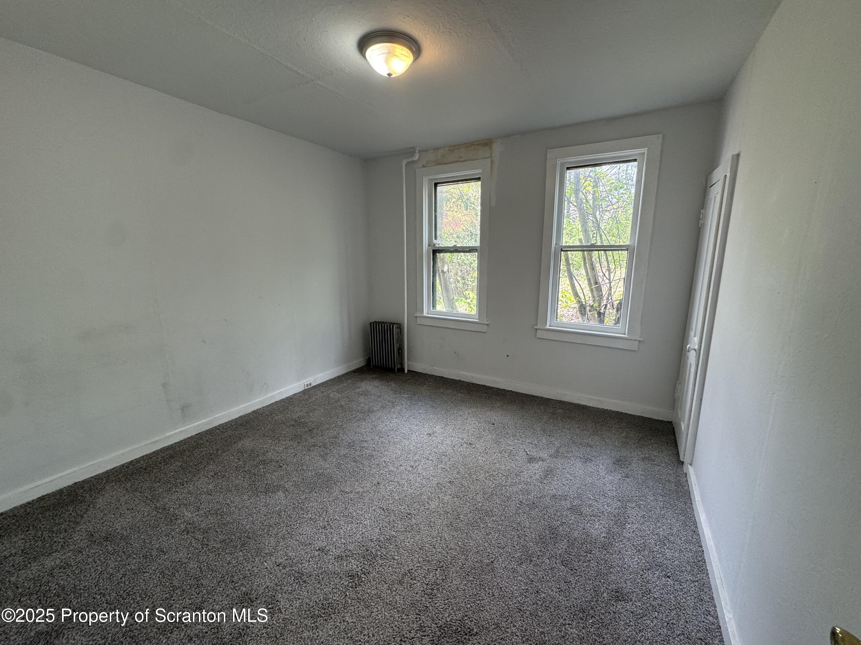 627 South Blakely Street Scranton, PA 18510 - Photo 7 of 13 an empty room with windows